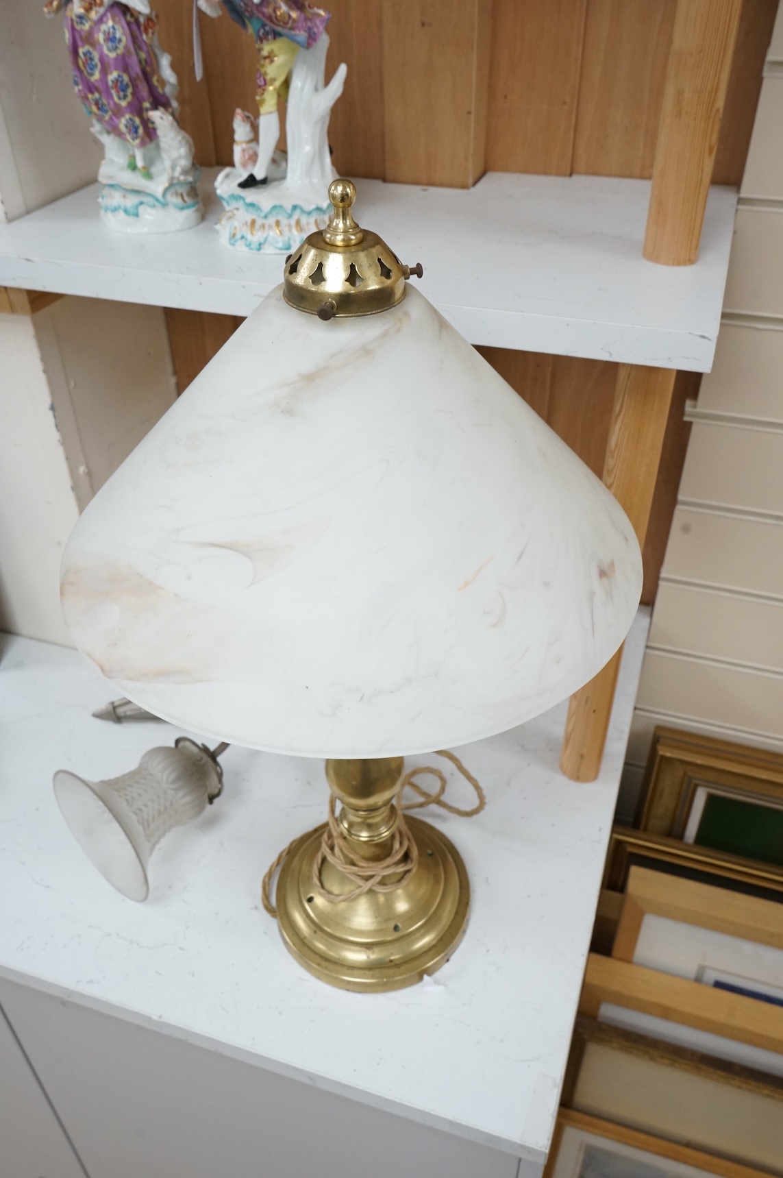 A brass table lamp and a chrome Art Deco style wall light, both with glass shades, lamp 58cm high
